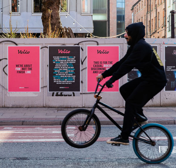 Brand identity for Velio Festival, blending music and cycling culture. Bright colours and cyclist visuals boost brand energy. Designed with Guy Pittard.