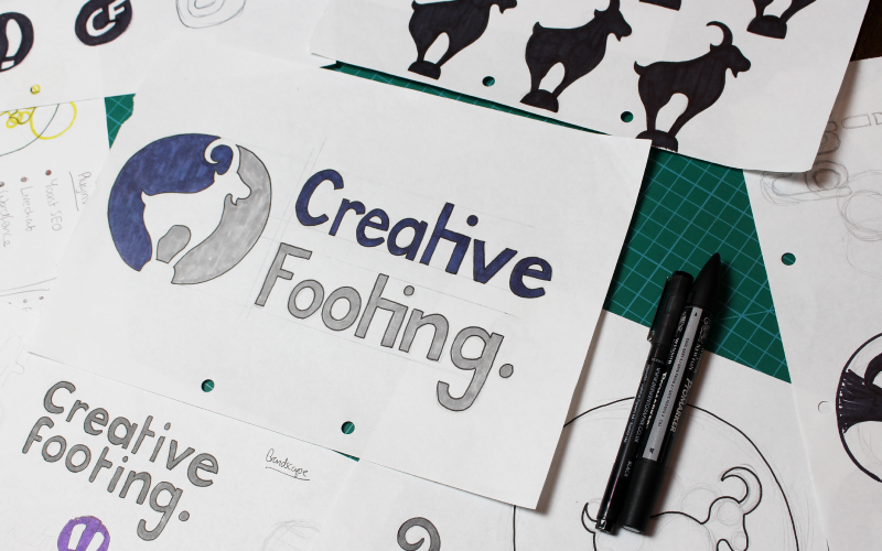 Initial logo design sketches for Creative Footing, illustrating the creative process behind the brand identity.