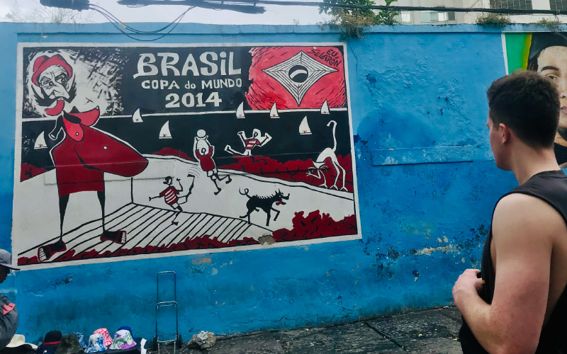 Abstract street art mural in Rio de Janeiro celebrating the 2014 World Cup, featuring vibrant colours and expressive design.