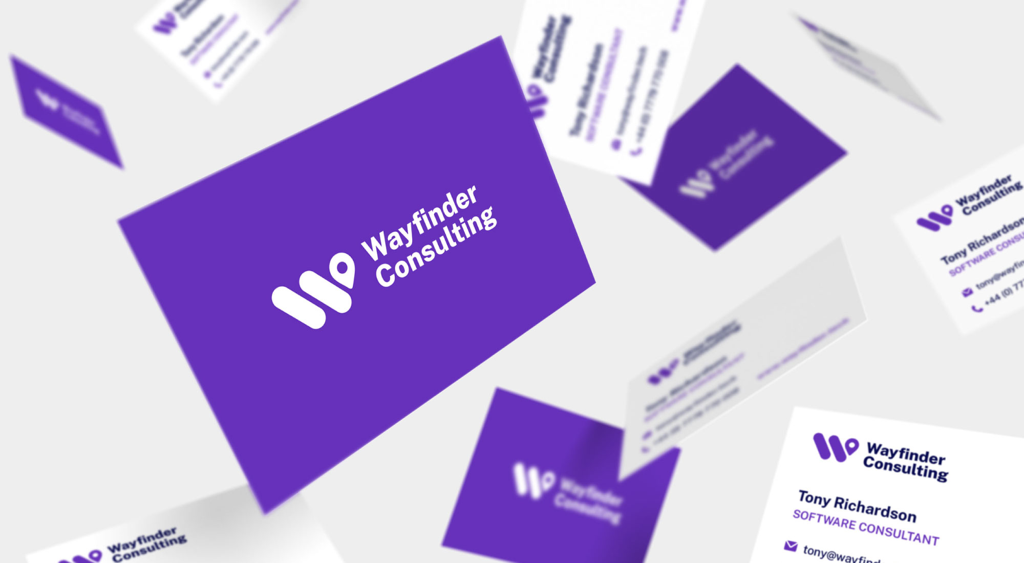 Business card mockup for Wayfinder Consulting with a clean layout, purple accents, and modern typography.
